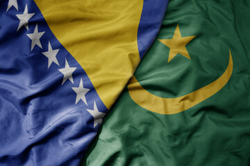 big waving national colorful flag of mauritania and national flag of bosnia and herzegovina.
