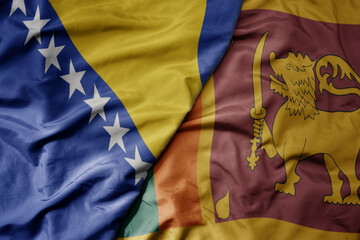 big waving national colorful flag of sri lanka and national flag of bosnia and herzegovina.