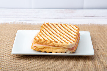 A mouthwatering ham and cheese sandwich, a classic comfort food delight, perfect for any time of...