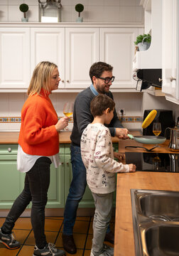 Family Cooking Together in a Cozy Kitchen