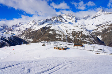 Fototapeta premium Riffelboden next to the railway track of the Gornergrat Bahn in the Zermatt winter sports resort in the Swiss Alps, Canton of Valais, Switzerland