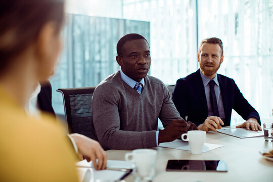Diverse business professionals in a corporate meeting