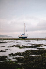 Abersoch bay at low tide with isolated boat
