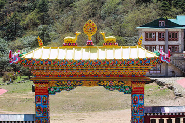 Entrance gate to the Dawa Choling Tibetan Buddhist Monastery situated at 3867 meters in Tengboche village, Nepal - obrazy, fototapety, plakaty