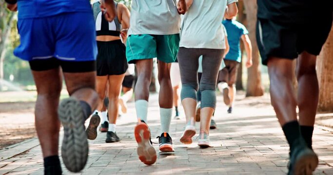 Group, legs and running for practice, fitness and exercise in park for urban marathon club in Dallas. Diversity, people and sneakers for cardio, health and wellness as workout, training and sport