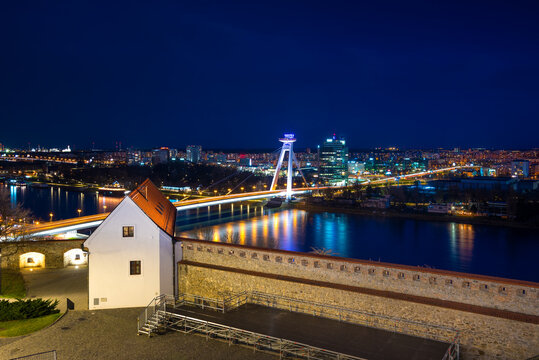 Night shot of historical center with the castle over Danube river, Bratislava, Slovakia