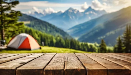 Foto op Canvas wooden table background of free space for your decoration and blurred background of camping in mountains © Kendrick