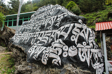 Buddhist Mantra - Om Mani Padme Hum is painted on the rocks along the trekking route to the Everest...