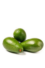 Avocados isolated on white background with clipping path. A pile of sliced avocados.