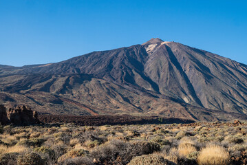 Cosmic landscapes with lava stones in the Teide Volcano National Park in the Canary Islands, view of the top of the mountain