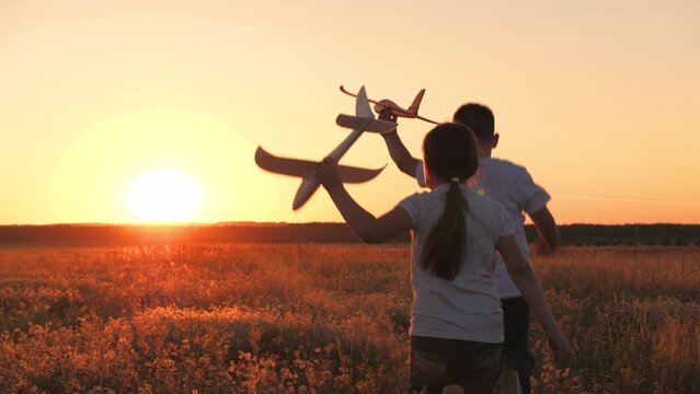 Child Airplane, Children Dream Airplane Pilot, Child Kid Boy Girl Running With Toy Airplane Across Field, Working Team Pilots, Silhouette Happy Children Running With Toy Airplanes Hands, Happy Boy