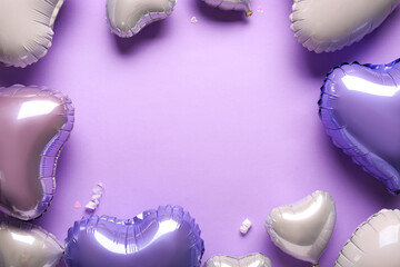 Frame made of heart shaped air balloons on lilac background. Valentine's Day celebration