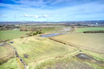 Aerial photo of the West Sussex countryside after heavy rainfall at Atherington and Climping beach.