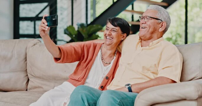 Home, selfie and old couple on a couch, love and memory with social media post and romance. Apartment, happy elderly man and senior woman on sofa, marriage or relationship with digital app for camera