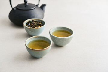 two ceramic cups of green tea