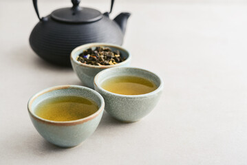 two ceramic cups of green tea