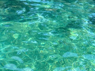 Sea water underwater clear blue green surface.