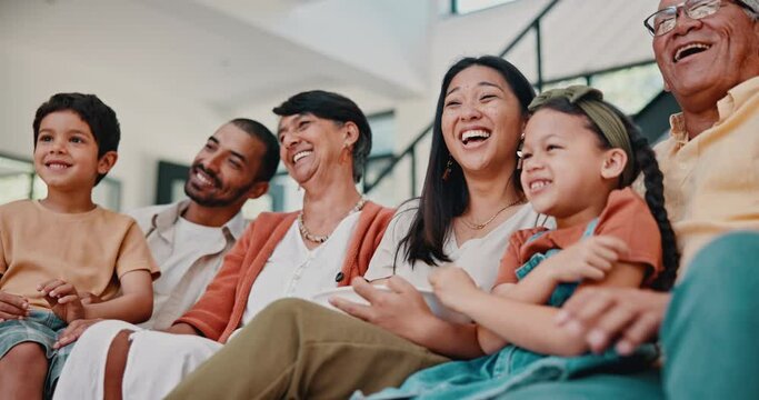 Funny, family and watching tv on sofa in home streaming movies or video in Mexico. Grandparents, parents and children relax on couch together in house with popcorn and happiness from comedy film