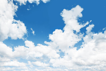Heaven background. Cloudy sky background. Peaceful bright blue sky texture. Fluffy clouds on the sky background. Cloudscape view.