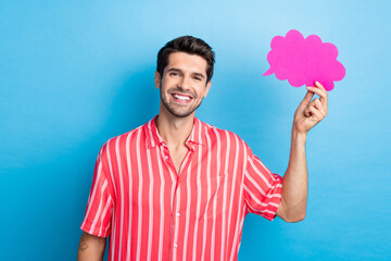 Portrait of toothy beaming cheerful guy with stubble wear stylish shirt arm holding paper mind...