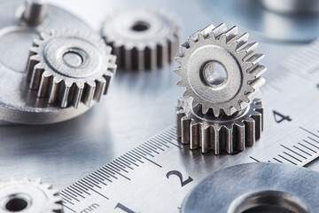 metal gears and bearings. Background with part of the mechanism.