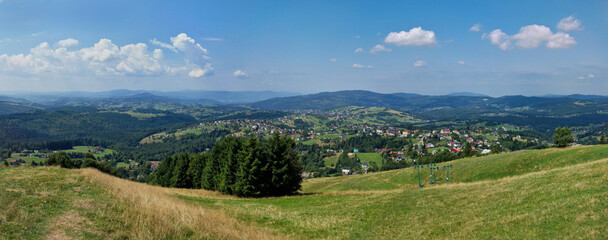 panoramic view from Ochodzita peak in Beskidy Mountains on village Koniakow Poland