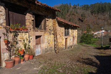 Beautiful village of Carmona with mountain typical stone houses in a sunny day. Cantabria, Spain.