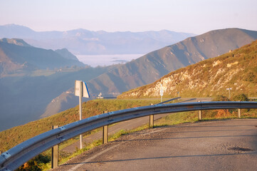 road in the mountains in a foggy day