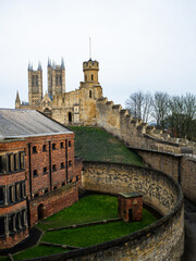 Tourists walking along the busy streets of the city of Lincoln and the castle. City Life Editorial...