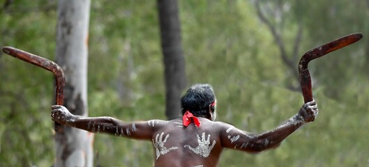 :Indigenous Australians man holding boomerang on ceremonial dance in Laura Festival Cape York...