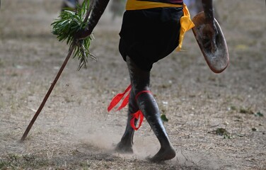 Indigenous Australian man holding weapons on ceremonial dance in Laura Festival Cape York Australia
