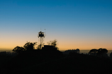 A watchtower against the African sunrise.  Photographed in Mapumalanga, South Africa.