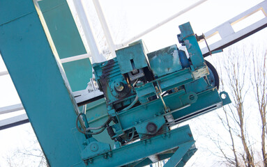 Old industrial metal electric motor, Ferris wheels. Iron dilapidated engine.