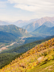 mountains, sky and green and yellow forest in valley. Place for trekking tourism - 751836494