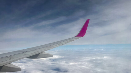 Fototapeta na wymiar View of airplane wing during flight