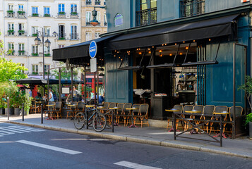 Cozy street with tables of cafe  in Paris, France. Cityscape of Paris. Architecture and landmarks of Paris - 751837414