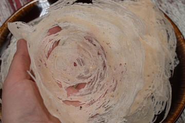 Wheat starch pancakes on brown plate