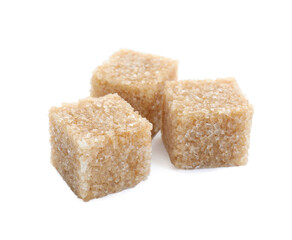 Three brown sugar cubes isolated on white