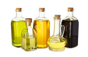 Vegetable fats. Glassware of different cooking oils isolated on white