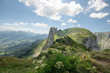 Summer view on Saxer Lücke in Alpstein mountains in Switzerland during summer. Beautiful hike from  Hohen Kasten toward the beautiful rock formation Saxer Lücke. Wonderful Swiss alpine landscape.