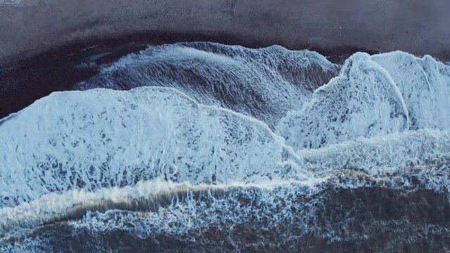 Arial drone view of crashing waves at north sea coast in Denmark