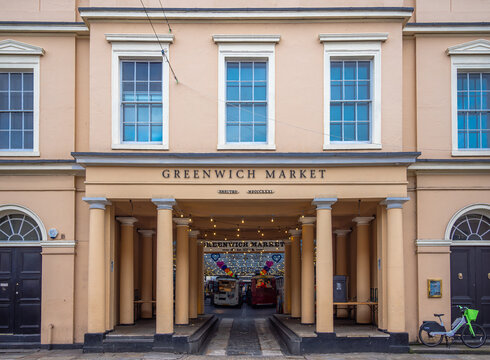 London, United Kingdom - February 26, 2024: Entrance to historic Greenwich Market hall with stalls and shops selling antiques, art and other goods as well as street food.