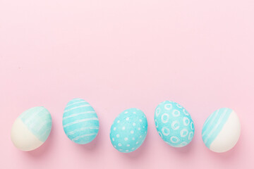 Fototapeta na wymiar Blue easter eggs on color background, top view