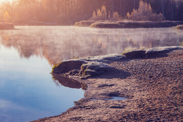Lake shore at early morning autumn time. - 751865491