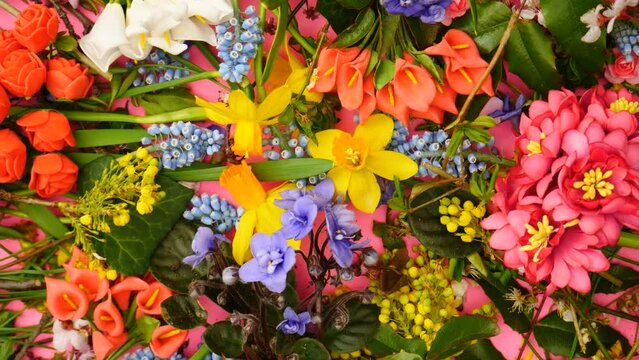 Top view of spring background, colorful flowers on the table