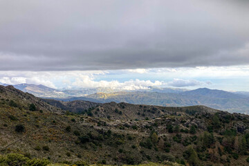 Panoramic view from hiking trail to Maroma peak in thunderstorm day, Sierra Tejeda, Spain 