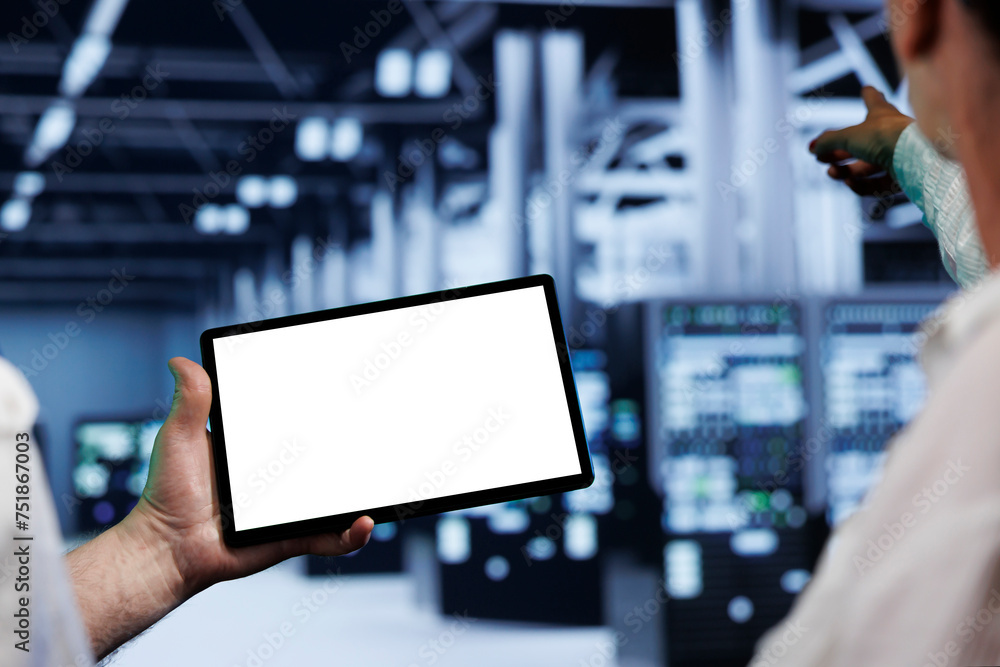 Poster old coworkers in high tech location using mock up tablet to set up configuration management tools th