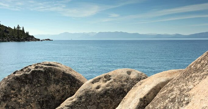 Scenic nature view over Lake Tahoe from the rocky boulders on shore in summer