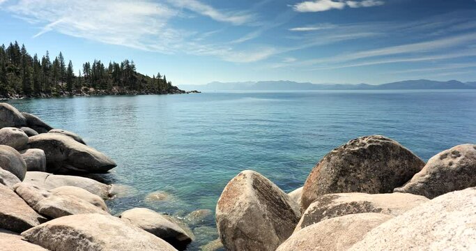 Scenic nature view over Lake Tahoe from the rocky boulders on shore in summer