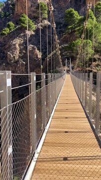 Hiking trail to Colgante bridge (Puente Colgante El Saltillo) over Almanchares river, Sierra Tejeda, Andalusia, Spain